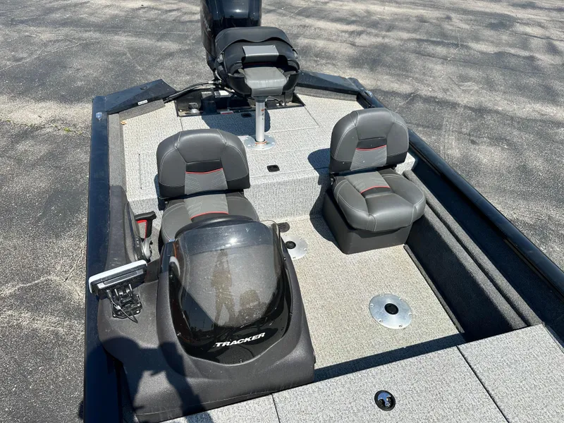 Slide: The Image of 2023 Tracker 175 Pro Team boat interior with seating and steering console. - 7