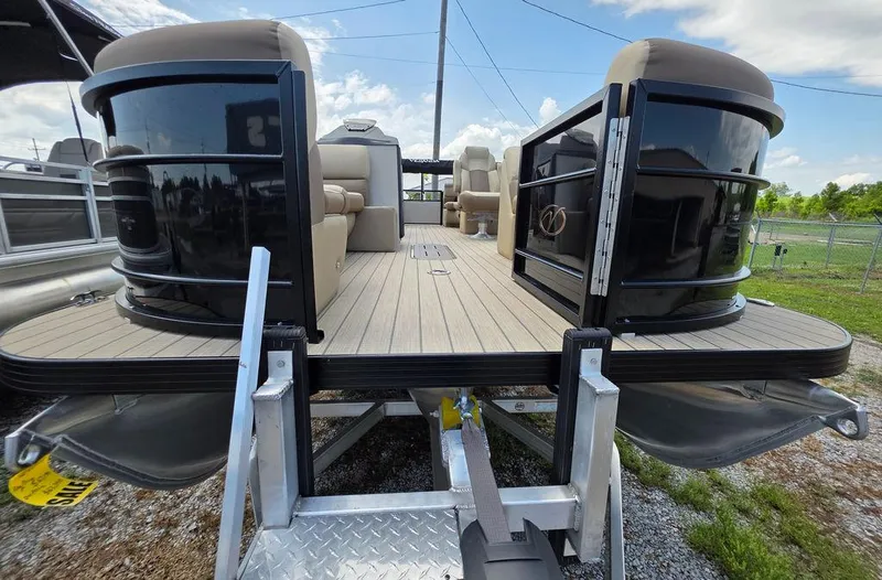 Slide: The Image of 2025 Veranda VR22RC XL Tri-Toon pontoon boat on trailer, showcasing spacious deck and seating. - 10