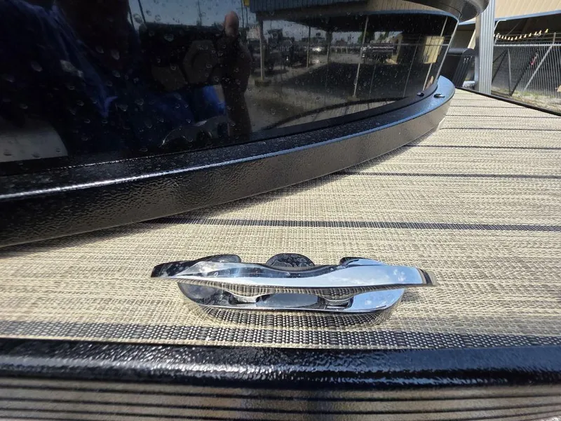 Slide: The Image of 2025 Veranda VR22RC XL Tri-Toon boat cleat on deck, close-up view. - 13