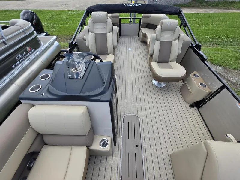 Slide: The Image of 2025 Veranda VR22RC XL Tri-Toon boat interior with beige seating and sleek design. - 18