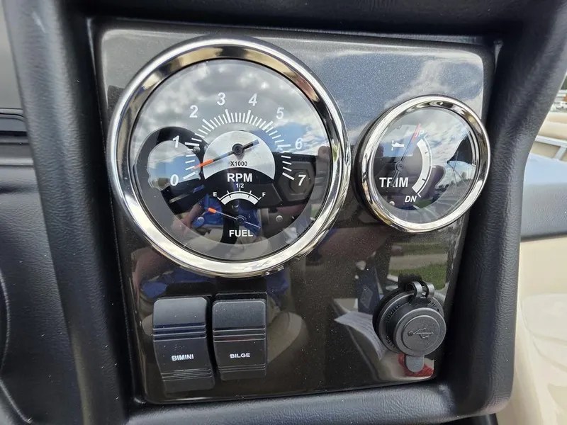 Slide: The Image of Dashboard of 2025 Veranda VR22RC XL Tri-Toon with RPM and fuel gauges. - 28