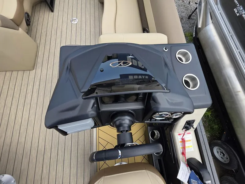 Slide: The Image of 2025 Veranda VR22RC XL Tri-Toon helm with steering wheel and control panel. - 30
