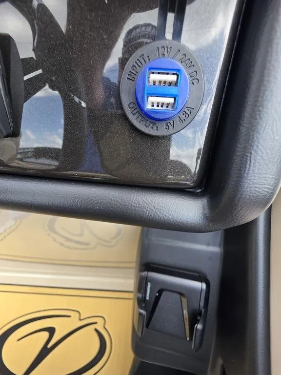 Slide: The Image of 2025 Veranda VR22RC XL Tri-Toon dashboard with dual USB charging ports. - 32