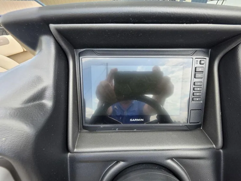 Slide: The Image of Garmin display on 2025 Veranda VR22RC XL Tri-Toon dashboard, featuring sleek black design. - 33