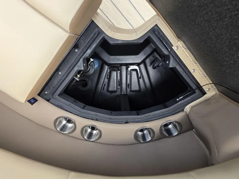 Slide: The Image of Interior storage compartment of 2025 Veranda VR22RC XL Tri-Toon boat with cup holders. - 37