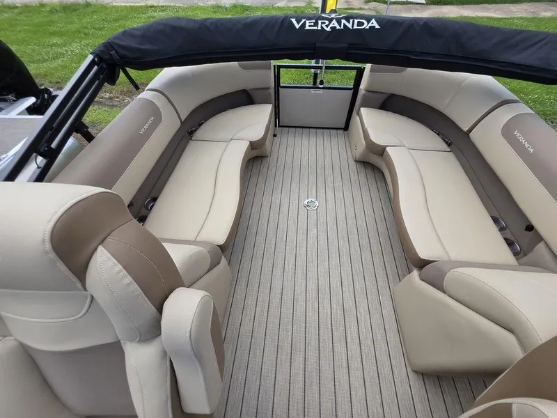 Slide: The Image of 2025 Veranda VR22RC XL Tri-Toon boat interior with beige seating and sleek design. - 39