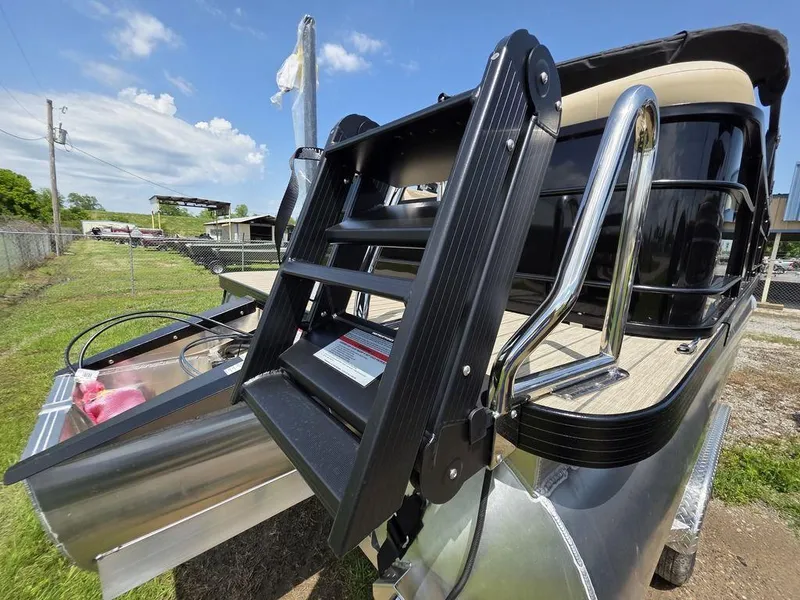 Slide: The Image of 2025 Veranda VR22RC XL Tri-Toon boat ladder and deck, sunny day, outdoor setting. - 6