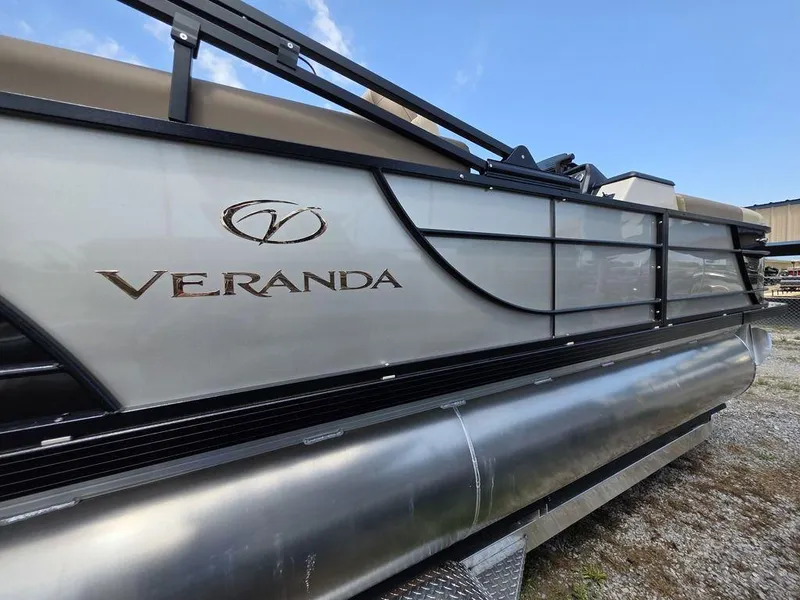 Slide: The Image of 2025 Veranda VR22RC XL Tri-Toon pontoon boat, side view, showcasing sleek design and logo. - 7