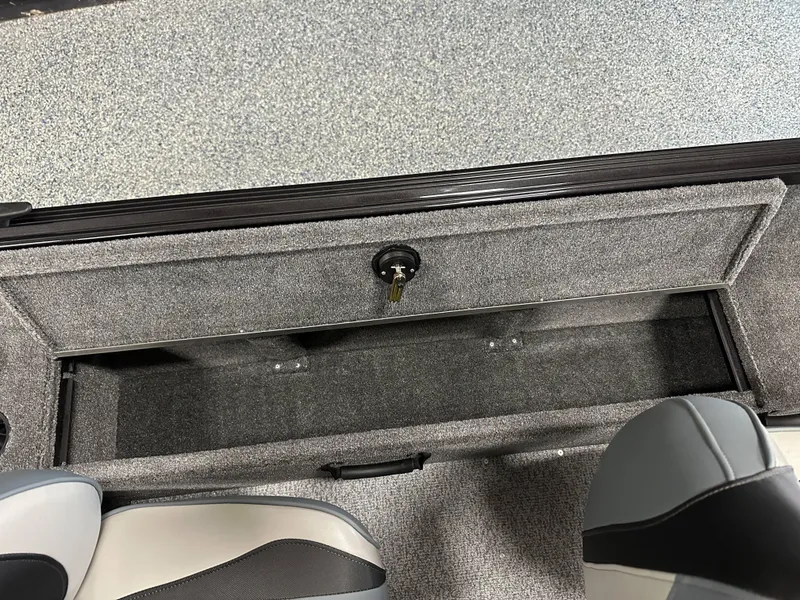 Slide: The Image of 2024 Alumacraft Classic 165 SC boat storage compartment with lock and seating. - 11