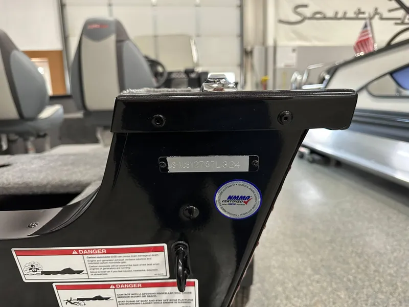 Slide: The Image of 2024 Alumacraft Classic 165 SC boat detail with safety labels and certification badge. - 19