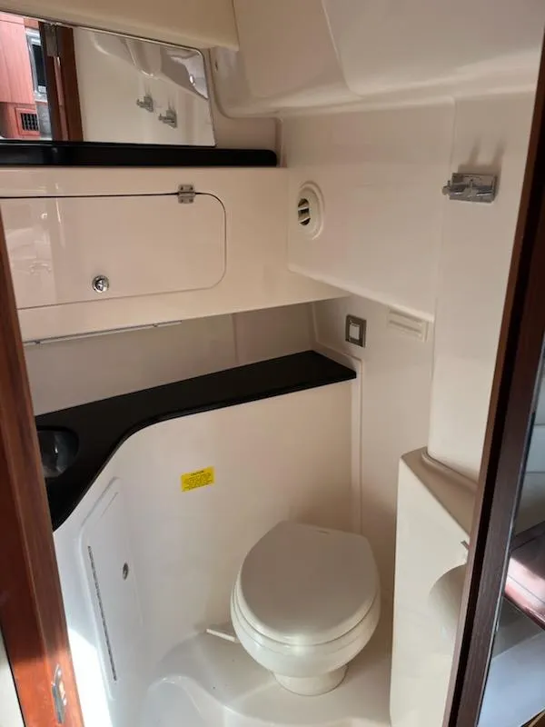 Slide: The Image of 2019 Grady-White Express 330 boat bathroom with modern fixtures and compact design. - 13