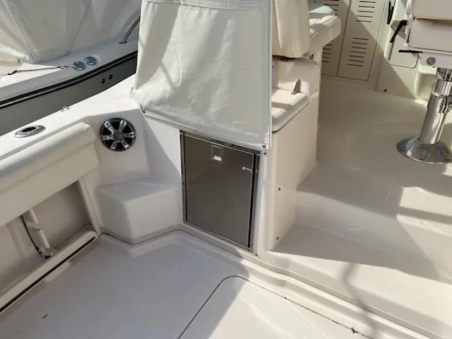 Slide: The Image of 2019 Grady-White Express 330 boat interior with seating and storage. - 5