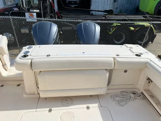 Slide: The Image of 2019 Grady-White Express 330 boat with dual outboard motors and spacious deck area. - 6