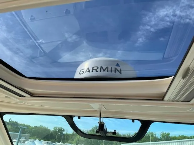 Slide: The Image of Skylight view from 2019 Grady-White Express 330, featuring Garmin equipment. - 9