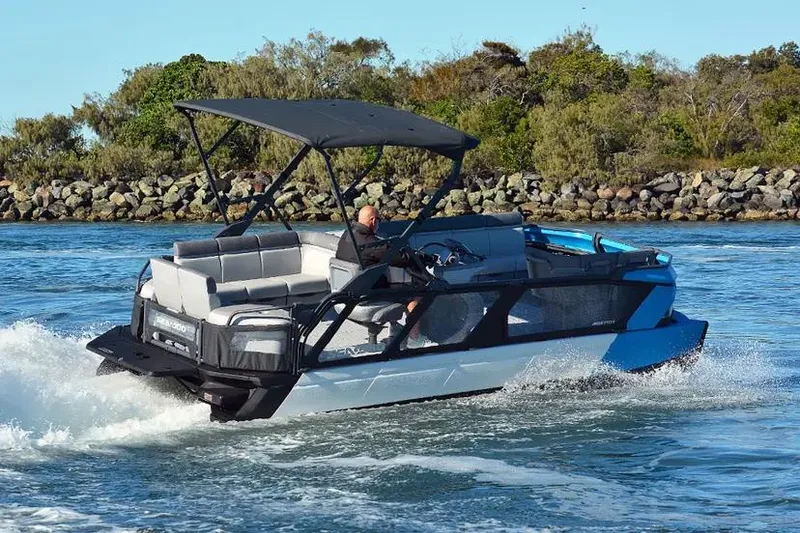 Slide: The Image of 2024 Sea-Doo Switch® Cruise 21 boat cruising on water, featuring sleek design and powerful 170 hp engine. - 10