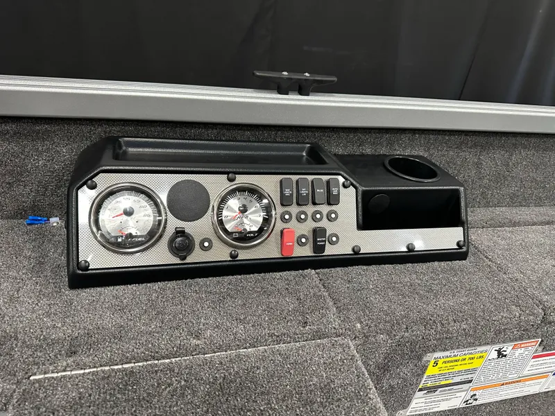 Slide: The Image of 2024 Alumacraft Classic 165 Tiller dashboard with gauges and controls. - 10