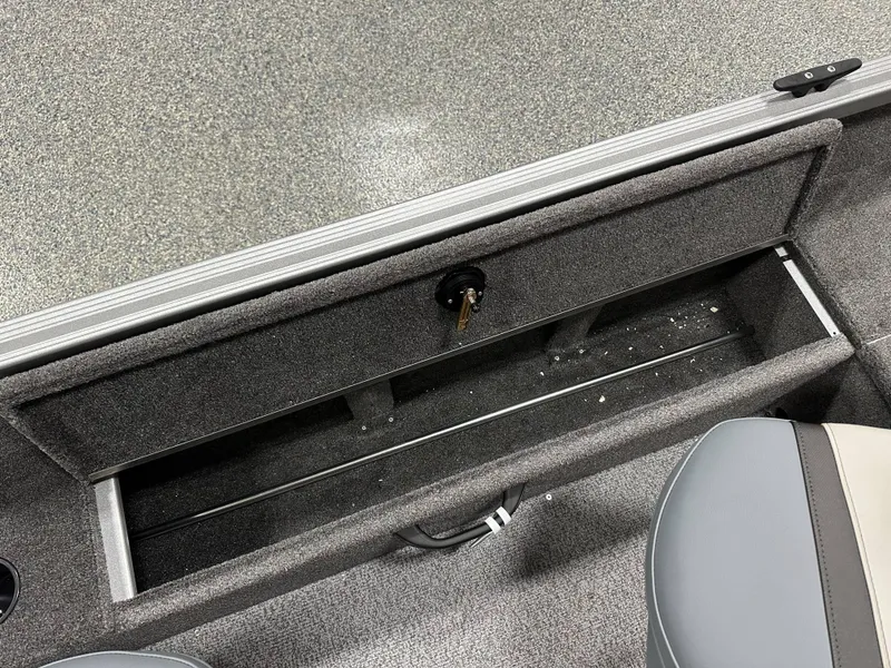Slide: The Image of 2024 Alumacraft Classic 165 Tiller boat storage compartment with key lock and seating. - 8