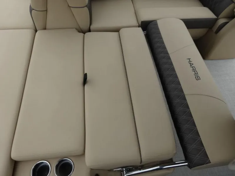 Slide: The Image of 2023 Harris Sunliner 230 boat interior with beige seating and cup holders. - 10