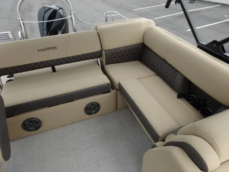 Slide: The Image of Luxurious seating on 2023 Harris Sunliner 230 pontoon boat with beige upholstery and cup holders. - 16
