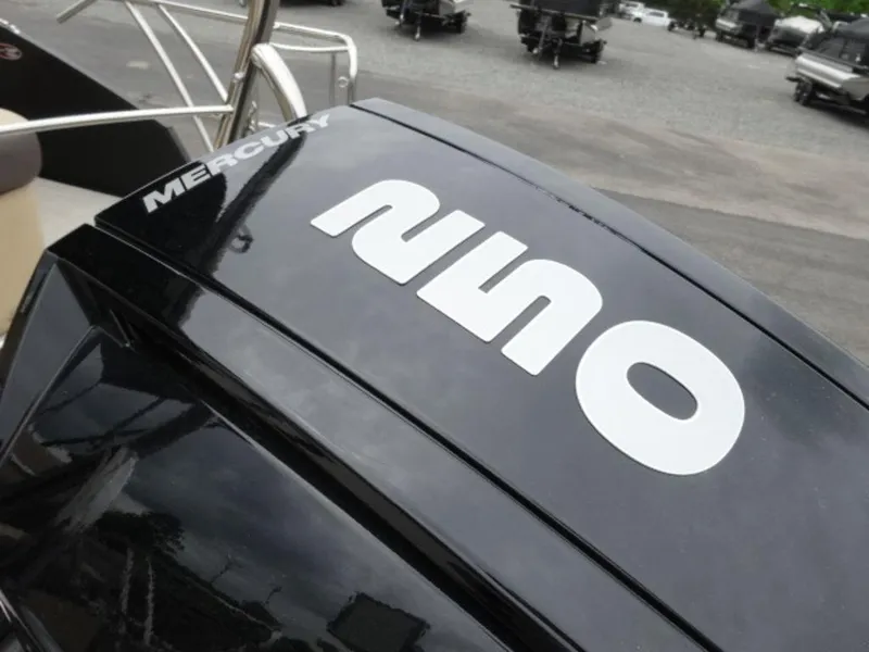 Slide: The Image of 2023 Harris Sunliner 230 boat with Mercury engine, close-up view of the motor. - 20