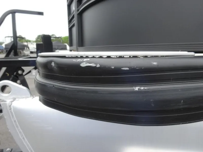 Slide: The Image of Close-up of 2023 Harris Sunliner 230 boat detail, featuring black and silver components. - 22