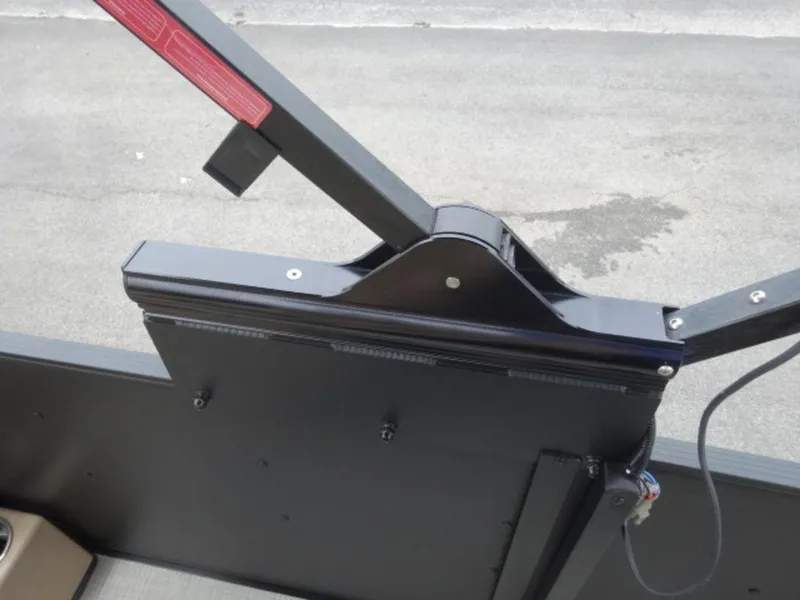 Slide: The Image of 2023 Harris Sunliner 230 boat component with black metal structure and wiring. - 8