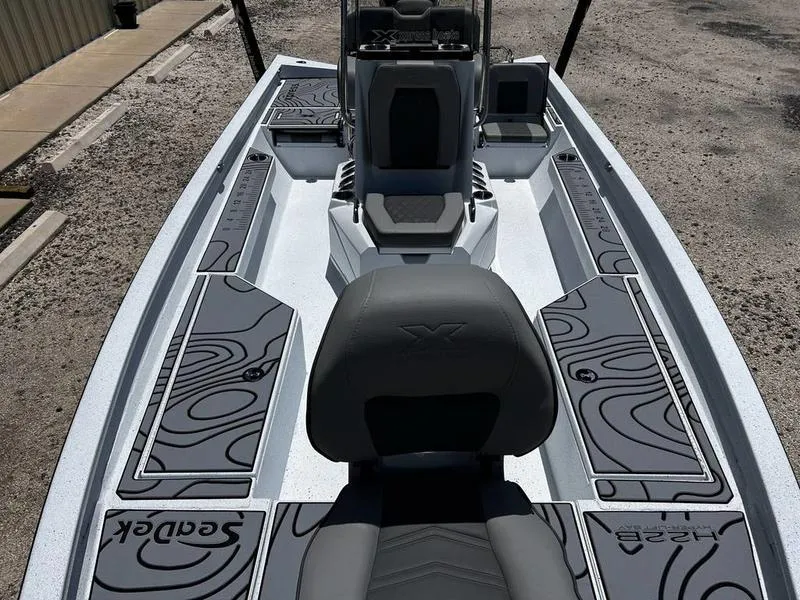 Slide: The Image of 2025 Xpress H22B boat interior with sleek seating and modern design. - 10