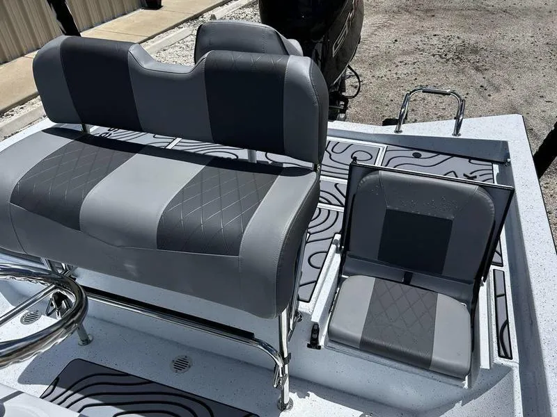 Slide: The Image of 2025 Xpress H22B boat seats with modern gray upholstery and stylish design. - 12