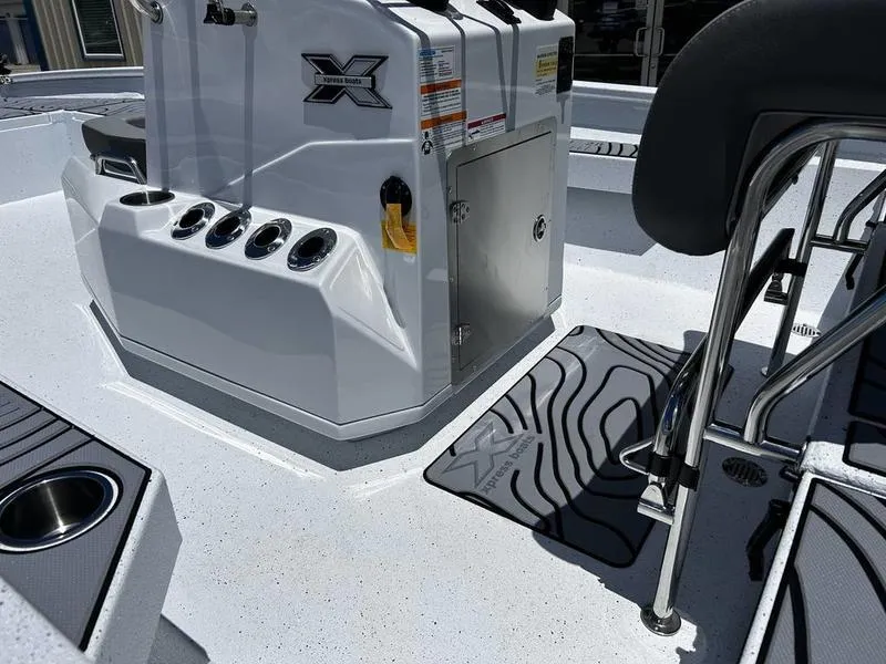 Slide: The Image of 2025 Xpress H22B boat interior with console and seating area. - 8