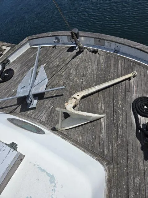 Slide: The Image of 1978 Formosa 46 sailboat deck with anchors and ropes. - 20