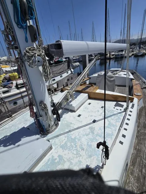 Slide: The Image of 1978 Formosa 46 sailboat docked in marina, showing deck and mast details. - 22
