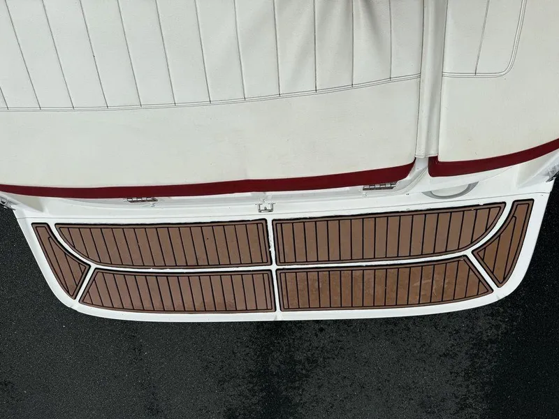 Slide: The Image of 2016 Bayliner VR5 Bowrider swim platform with wood finish, viewed from above. - 17