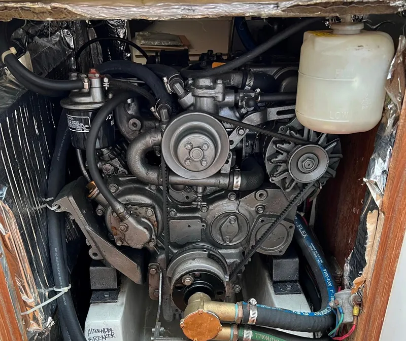 Slide: The Image of Engine compartment of a 1998 J Boats J 42 sailboat, showcasing mechanical components. - 15