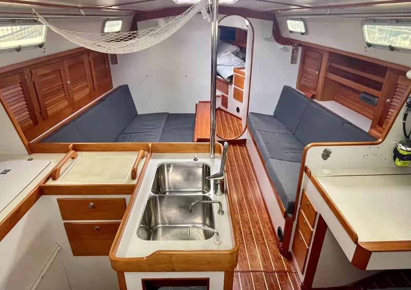 Slide: The Image of Interior of 1998 J Boats J 42 sailboat with wood finish and dual sinks. - 7