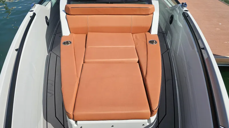 Slide: The Image of 2023 Saxdor 320 GTO boat with luxurious tan seating and cup holders. - 18