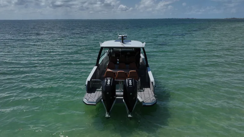 Slide: The Image of 2023 Saxdor 320 GTO boat on clear ocean water, rear view. - 3
