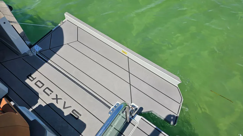 Slide: The Image of 2023 Saxdor 320 GTO boat platform on green water. - 31