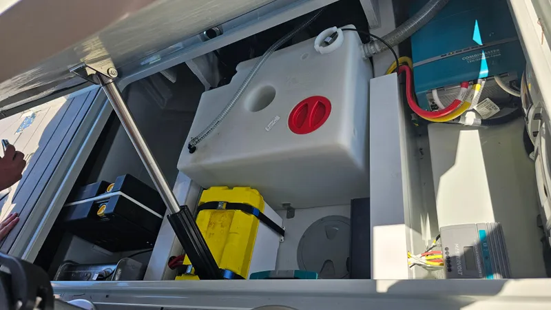 Slide: The Image of 2023 Saxdor 320 GTO engine compartment with battery and fuel tank components. - 32