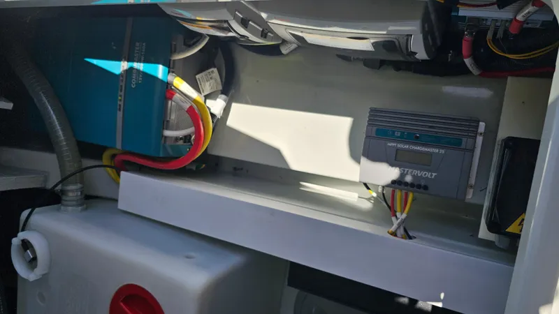 Slide: The Image of Electrical components inside a 2023 Saxdor 320 GTO boat, featuring wiring and equipment. - 33