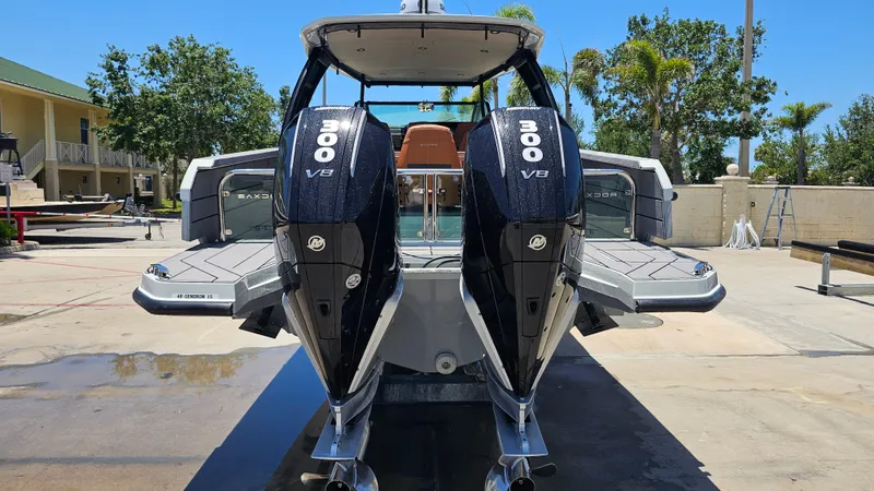 Slide: The Image of 2023 Saxdor 320 GTO with dual 300 V8 engines, docked outdoors. - 37