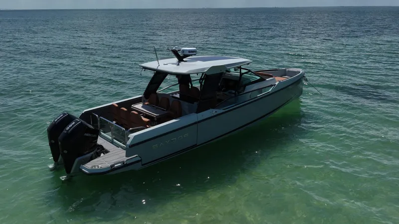 Slide: The Image of 2023 Saxdor 320 GTO boat on calm sea waters. - 4