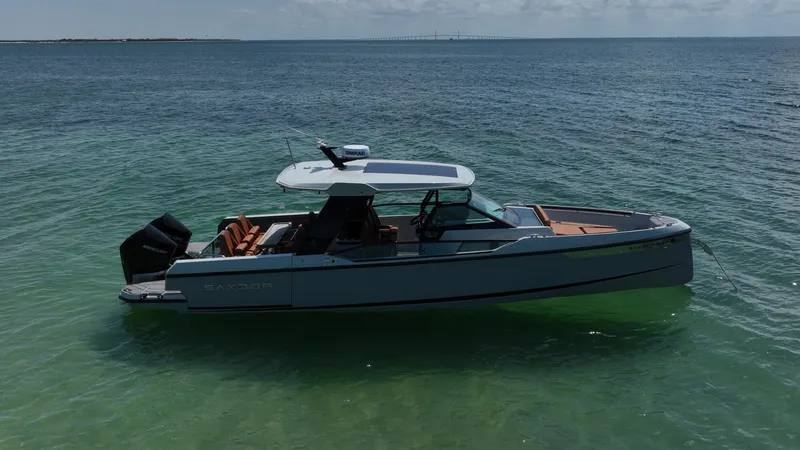 Slide: The Image of 2023 Saxdor 320 GTO boat on calm sea waters. - 5