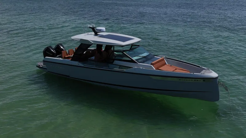 Slide: The Image of 2023 Saxdor 320 GTO boat on calm, clear water. - 6