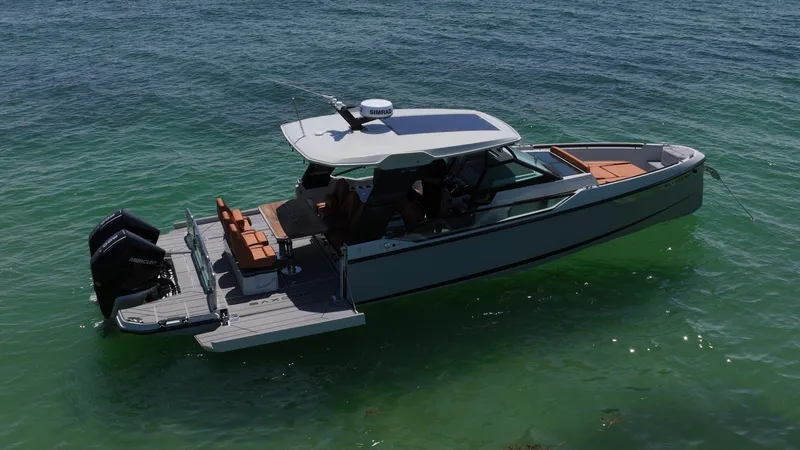 Slide: The Image of 2023 Saxdor 320 GTO boat on clear water, featuring sleek design and modern amenities. - 9