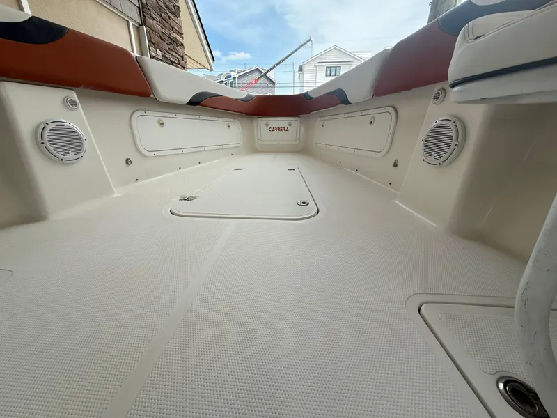 Slide: The Image of 2007 Carrera Boats 36 Center Console interior with spacious deck and built-in speakers. - 17