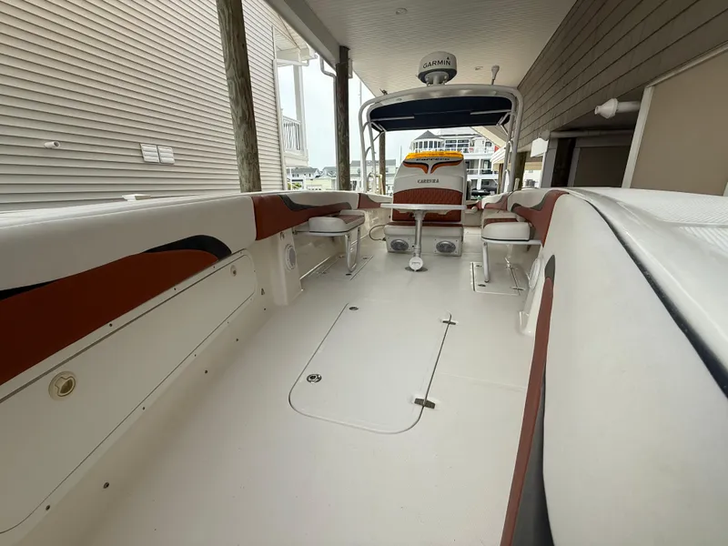 Slide: The Image of 2007 Carrera Boats 36 Center Console, spacious deck, sleek design, under covered dock. - 22