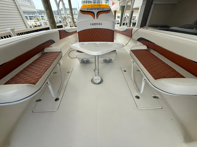 Slide: The Image of 2007 Carrera Boats 36 Center Console interior with seating and table. - 24