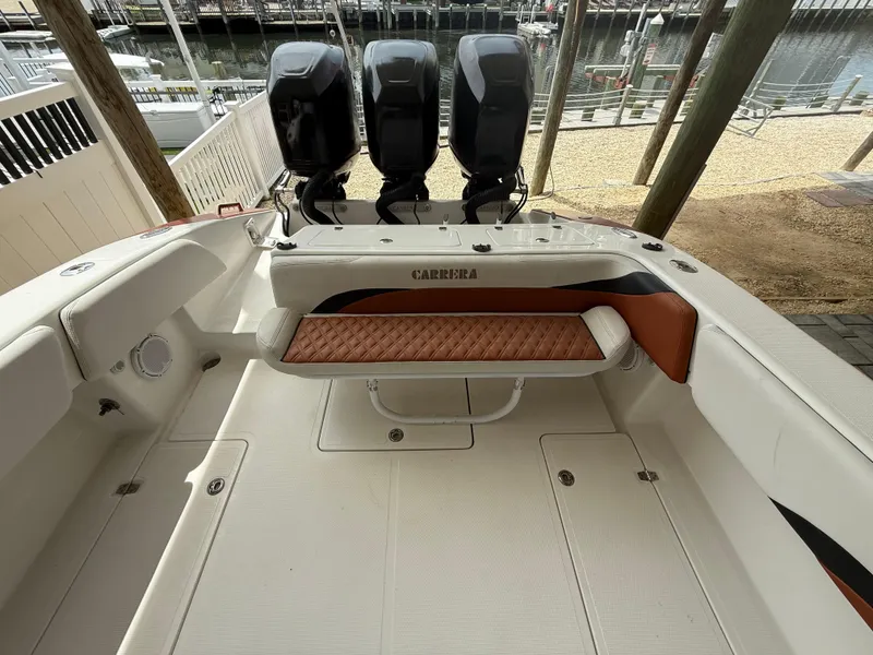 Slide: The Image of 2007 Carrera Boats 36 Center Console with triple outboard engines at dock. - 29