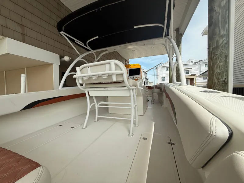 Slide: The Image of 2007 Carrera Boats 36 Center Console with white seating and black canopy. - 30