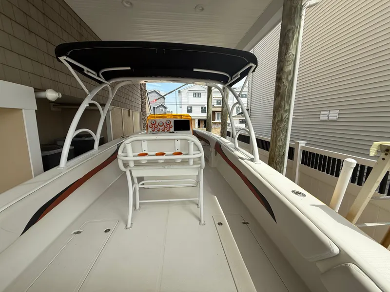 Slide: The Image of 2007 Carrera Boats 36 Center Console with T-top, docked in a covered area. - 31